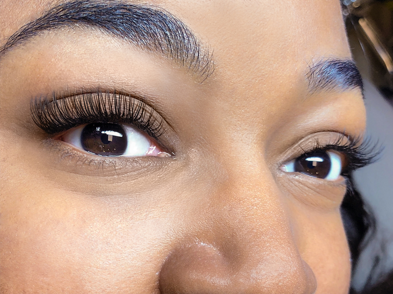 close-up of black woman's eyes with classic lash extensions